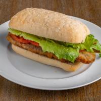 Beef Milanesa Sandwich · Breaded thin steak with tomato, lettuce and mayonnaise.
