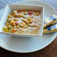 Chicken Tortilla Soup · Soup made with fried corn tortilla and seasoned tomato broth. 