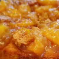 Peach Cobbler · Homemade Georgia peach cobbler, topped with brown sugar and butter.