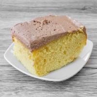 Golden Yellow Cake w/ Chocolate Icing · Our buttery golden yellow cake topped with a rich chocolate icing. 