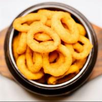 Oval Onion Rings · Freshly cut onions lightly battered and fried until golden crisp. Served with marinara sauce.