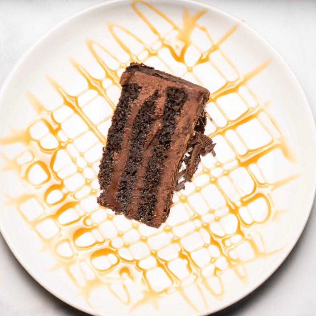 Chocolate Cake · Rich layered soft chocolate cake drizzled with caramel