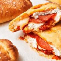 Tour of Italy  Specialty Calzone · Pizza cheese, pepperoni, meatball, sausage, salami, ricotta cheese, and provolone cheese.