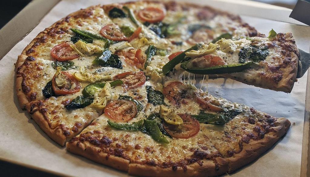 Mona Lisa Pizza · Garlic olive oil base, mozzarella, spinach, green peppers, artichokes, and tomatoes.