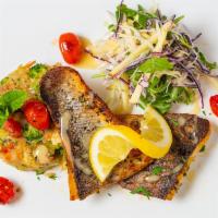 Branzino Filet Fish · Gluten free. Pan seared Mediterranean sea bass, caper lemon sauce, over Mediterranean cooked...