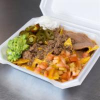 Supreme Large Nachos · Homemade chips, served with beans, sour cream, tomatoes and jalapenos.