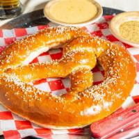 Massive Bavarian Pretzel · Queso dipping sauce and bourbon cracked mustard dipping sauce. (Serves 2-3).