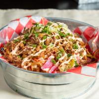 Spanglish Fries · Pulled pork, chipotle sour cream, pickled jalapenos, and red onion, tomatoes, guacamole, Cot...