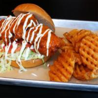 Buffalo Chicken Sandwich · Battered chicken thigh, Korean Buffalo sauce, lettuce, tomato, and ranch. Served with waffle...