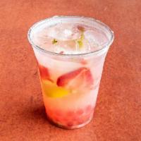 Strawberry Mojito Lemonade · Sweet delicious lemonade poured over muddled berries and mint.