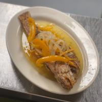 Red Snapper Escovich Lunch · Whole red snapper fried and seasoned, topped with escovitch sauce, peppers and onions. Serve...