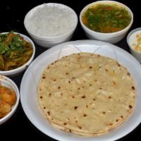 Veg Thali · 3 Rotis, Daal, Rice, and 2 Curries. For available curry choices please call us. Otherwise we...