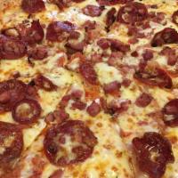 Meat Lovers Pizza · Pepperoni, bacon, ham, Italian sausage, mozzarella and tomato sauce.