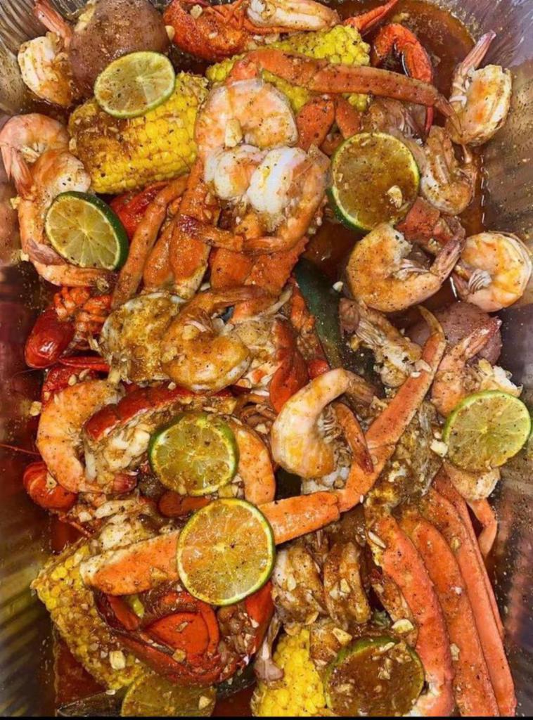 Family Deluxe Combo · Includes 3 corns, 3 potatoes, 1 lb. snow crab, 1/2 lb. clam, 1/2 lb. crawfish, 1/2 lb. shrimp (no head) and 1/2 lb. black mussel.