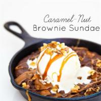 Brownie Skillet · brownie baked in a cast iron skillet topped with vanilla bean ice cream, salt caramel and to...