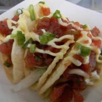 Tuna Poke Tacos · fried wontons, wakame, sambal aioli, cilantro