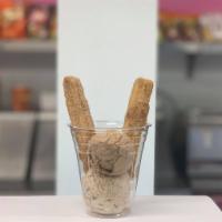 Churros con Nieve Double · Churros in a cup with two scoops of ice cream of your choice, and whipped cream and other to...