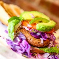 Chickpeas Burger w/ fried sweet plantains · Chick’n and burger house-made; chickpeas, spelt flour, hemp seeds, flax seeds served with Ja...