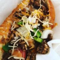 Sloppy Taco Dog · Grilled Hot Dog Smothered in our Meaty Taco Sauce topped with, onions, peppers, cheese and o...