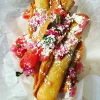 Taquitos  · Beef and Cheese Rolled in Corn Tortilla and Fried to Perfection. Topped with Crema, Pico De ...