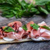 Italian Sandwich · On baguette tomato, mozzarella, capers, red onion, prosciutto ham, fresh balsamic glaze and ...