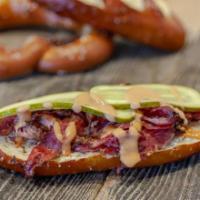 Brooklyn Sandwich · On pretzel bun, pastrami, pickle, onion, Swiss cheese and red sauce.