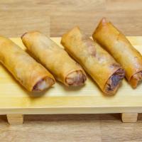 Chicken Spring Roll · Four rice paper/crispy dough rolls filled with shredded vegetables, noodles and chicken. 