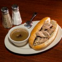 Italian Beef · Choice black angus beef seasoned, thinly sliced beef on a French roll.