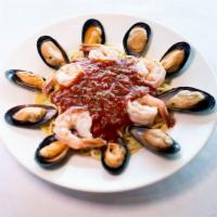 Seafood Spaghetti Marinara · Shrimp, mussels, and marinara sauce over spaghetti with garlic and Parmesan.
