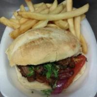 Pan con Lomito Saltado · Lomo saltado sandwich beef sauteed on wok with onions, tomatoes, cilantro and soy sauce serv...