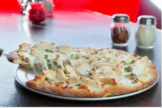 14. Garlic Chicken Pizza · Breath mints not included. Garlic chicken, mushrooms and green onion with mozzarella and provolone over Alfredo sauce.