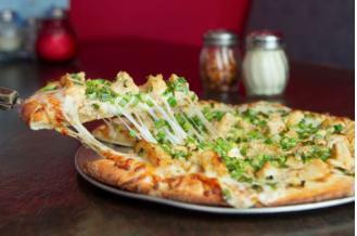 15. Mesquite Chicken Pizza · Better than BBQ. Mesquite chicken and green onions with mozzarella over BBQ sauce.