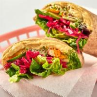 Hummus Wrap (Vegan) · Hummus, roasted carrots, cucumber, spicy sprouts, pickled cabbage and chile tahini dressing ...