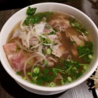 DacBiet · Vietnamese beef noodle soup with rare steak, well-done flank, tendon, scallions, cilantro  a...