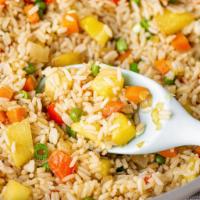 Pineapple Fried Rice · Stir fried rice with pineapple, egg, onion, broccoli, tomatoes and green onion. 