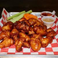Boneless wings · Hand Cut all white meat chicken, beer battered and fried. Tossed in your favorite wing sauce. 