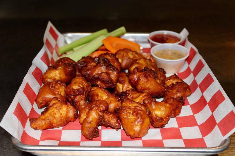 Boneless wings · Hand Cut all white meat chicken, beer battered and fried. Tossed in your favorite wing sauce. 