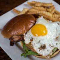 Hangover Burger · Grilled burger with yellow cheddar, Swiss, applewood smoked bacon, and a fried egg.