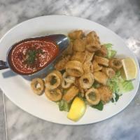 Calamari Fritti · Tender pieces of calamari lightly coated in breading, fried to golden perfection and served ...