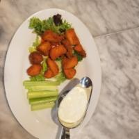 Boneless Buffalo Bites · 10 pieces. Served mild with celery and blue cheese for dipping.