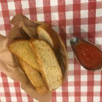 Garlic Bread · 5 pieces of our home made Italian garlic bread served with a side of our tomato sauce for di...