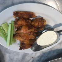 Traditional Chicken Wings · Served with celery and your choice of ranch or blue cheese for dipping.