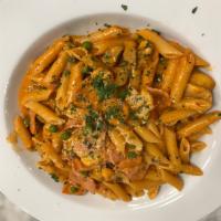 Penne Alla Vodka Dinner · Penne pasta, mushrooms, peas and ham sauteed in a light creamy rose sauce, topped with parme...