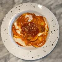 Ravioli Parma Dinner · Ravioli filled with a blend of 3 cheeses, tossed in a creamy meat ragu sauce, topped with Pa...