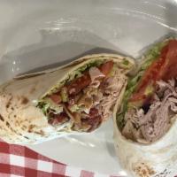 Turkey Club Wrap · Smoked turkey breast, bacon and provolone cheese with lettuce, tomato, onion, banana peppers...