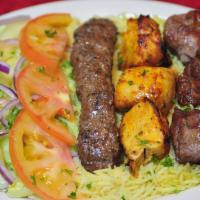 Oasis Platter · Cubes of lamb, chicken and kofta charbroiled, marinated and seasoned.  Served with 2 sides.