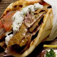 Lamb Gyro Sandwich · Charbroiled lamb gyro slices with lettuce, tomatoes, pickles and onion.