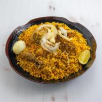 Chicken Dum Biryani · Long grain basmati rice cooked with saffron and spices. 