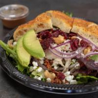 Goat Cheese Chicken Salad · Mixed greens, grilled chicken breast, goat cheese, bacon, red onions, avocados, roasted cash...