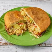 Torta Hawaiiana · Pineapple infused sandwich with chicken, sausage, ham, bacon , and American cheese. Topped w...